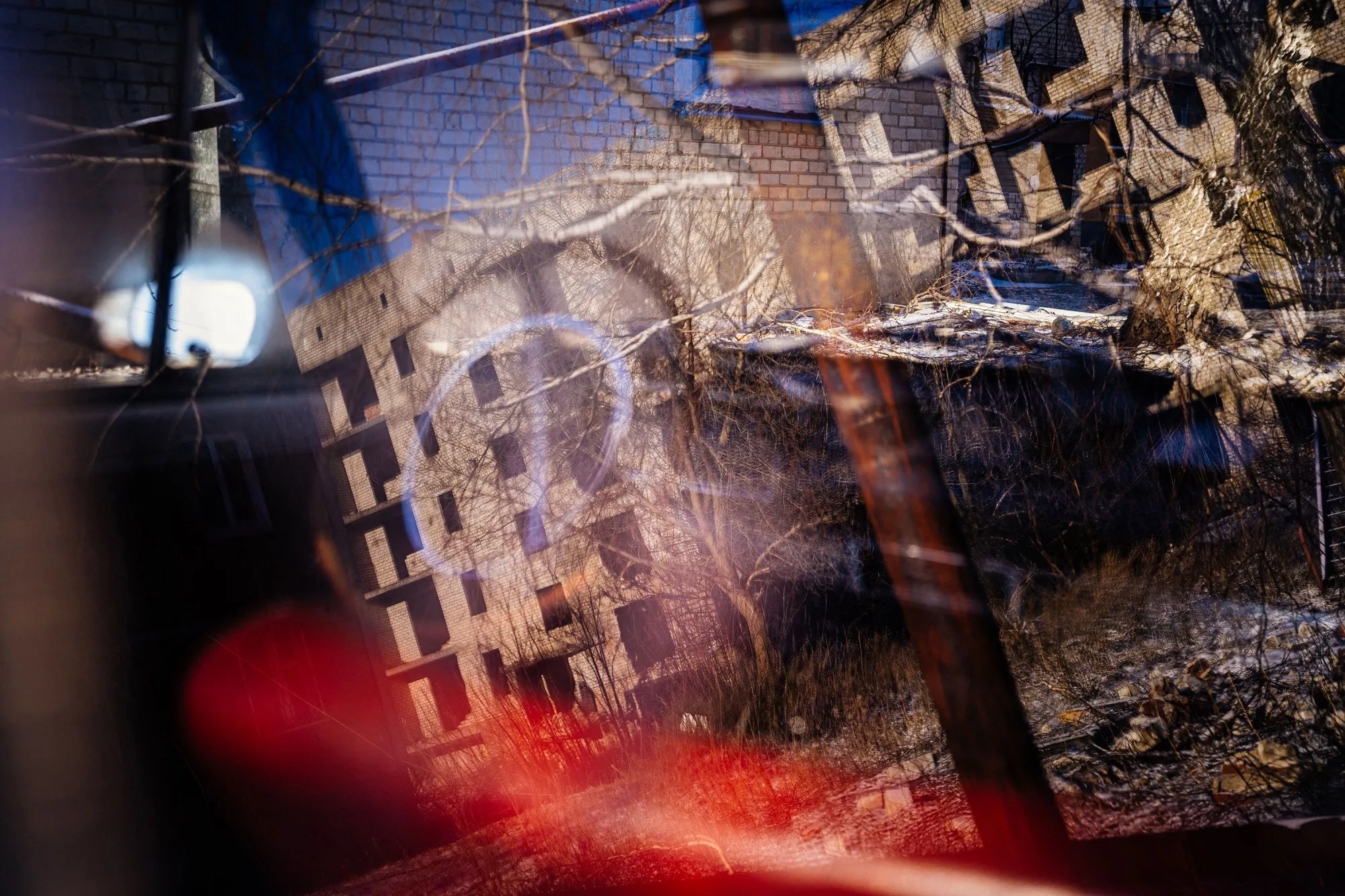 A partially destroyed residential building reflected in a car window in Chasiv Yar, Donetsk region, Ukraine, on Jan. 7.