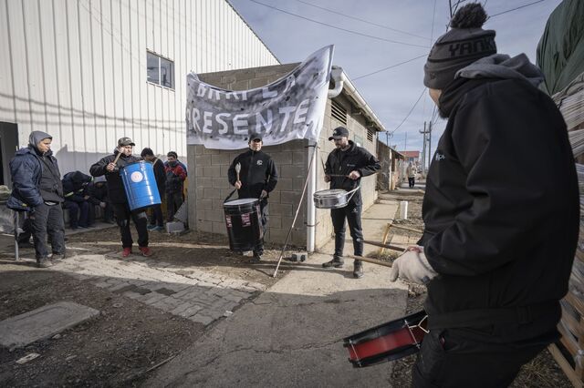 Barpla SA textile factory workers burn a fire and drum in protest of frozen operations after the textiles industry was left out of a decades-long extension of the island's fiscal benefits.