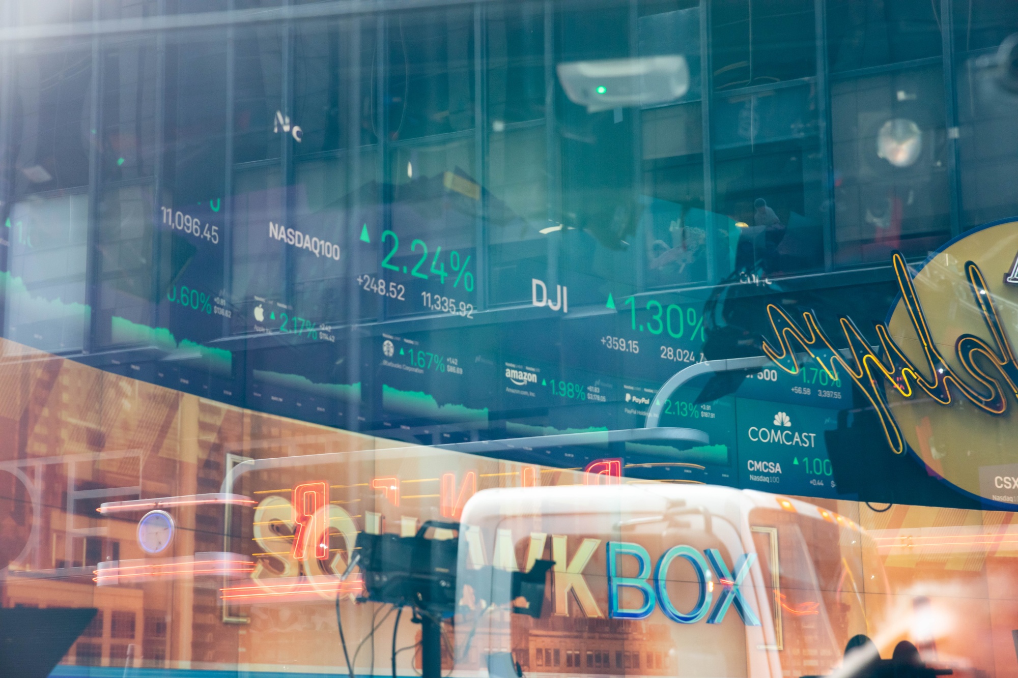 Stock market information is displayed on the Nasdaq MarketSite in the Times Square neighborhood of New York, USA, on Monday, September 14, 2020. US stocks hit a high of more than a week amid a flurry of deal activity and signs of progress toward a coronavirus vaccine.  The dollar weakened and Treasuries changed little.