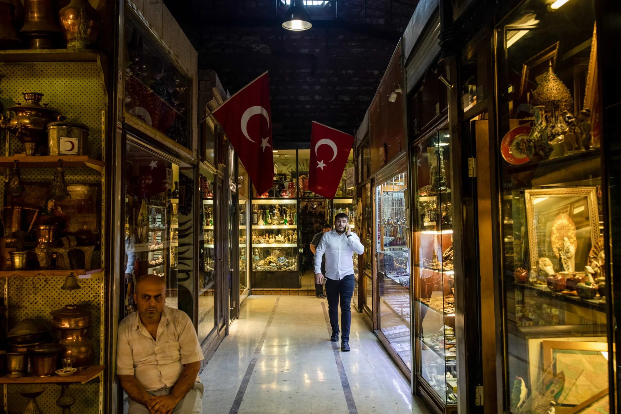 Merchants walk in the antiques section of the Grand Bazaar in Istanbul on Aug. 27.