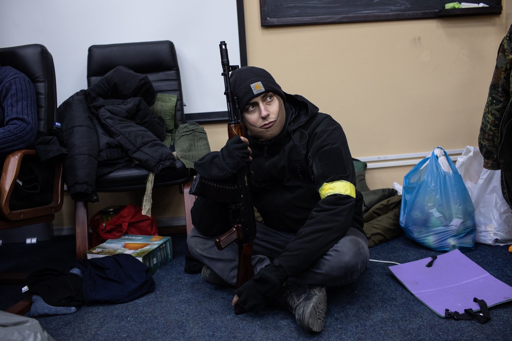 A Ukrainian civilian volunteer gets briefed on his&nbsp;new job.