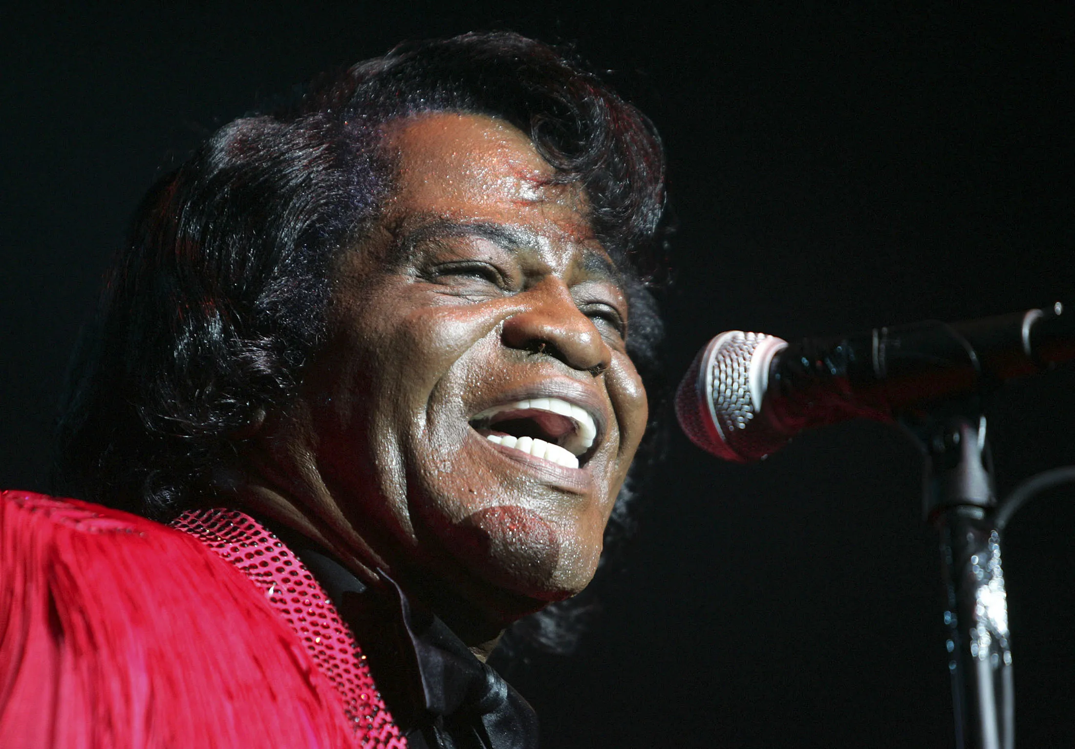 James Brown performs on stage in 2004.