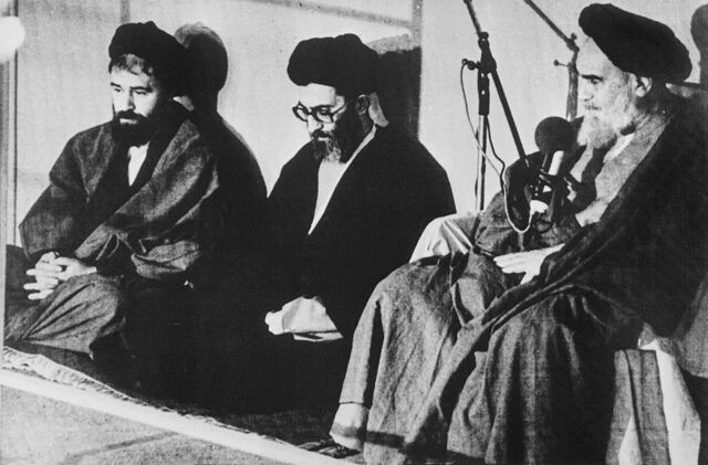 A picture taken on Oct. 9, 1981 in Tehran shows Ali Khamenei (center) with Imam Ruhollah Khomeini (right).