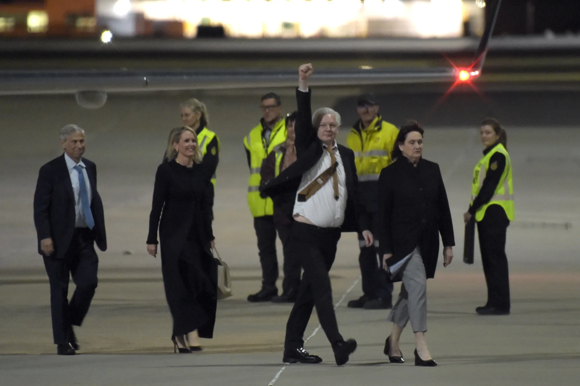 Julian Assange, co-founder of Wikileaks, center, arrives at Canberra Airport in Australia, on Wednesday, June 26, 2024.&nbsp;