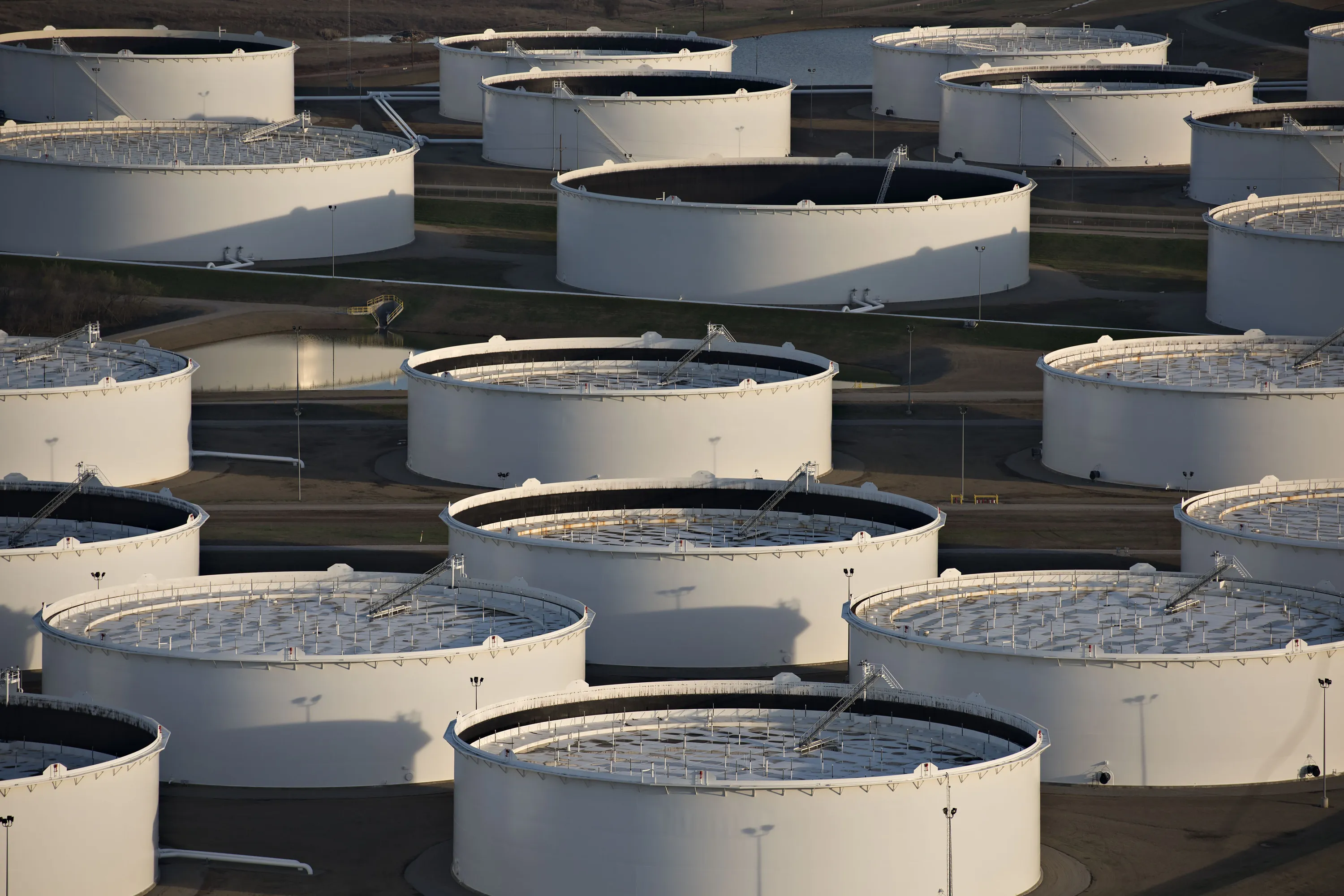 Oil storage tanks stand in this aerial photograph taken above Cushing, Oklahoma, U.S.
