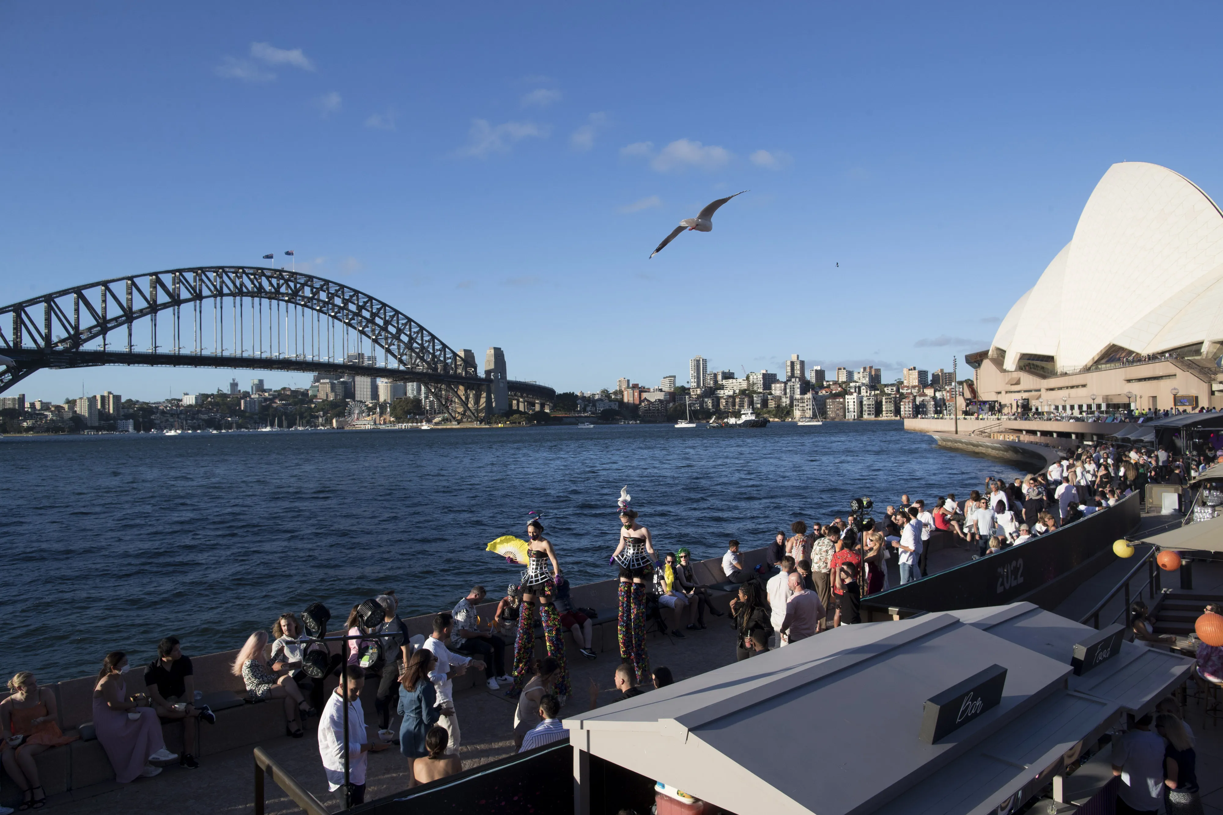 Visitors gather outside the Sydney Opera House.