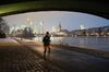 A jogger runs along a towpath as skyscrapers stand illuminated on the skyline beyond the River Main in Frankfurt, Germany, on Thursday, Jan. 24, 2019. ECB President Mario Draghi intensified his warning on the challenges facing the euro-area economy, signaling the European Central Bank could be even more cautious about any withdrawal of crisis-era stimulus this year.