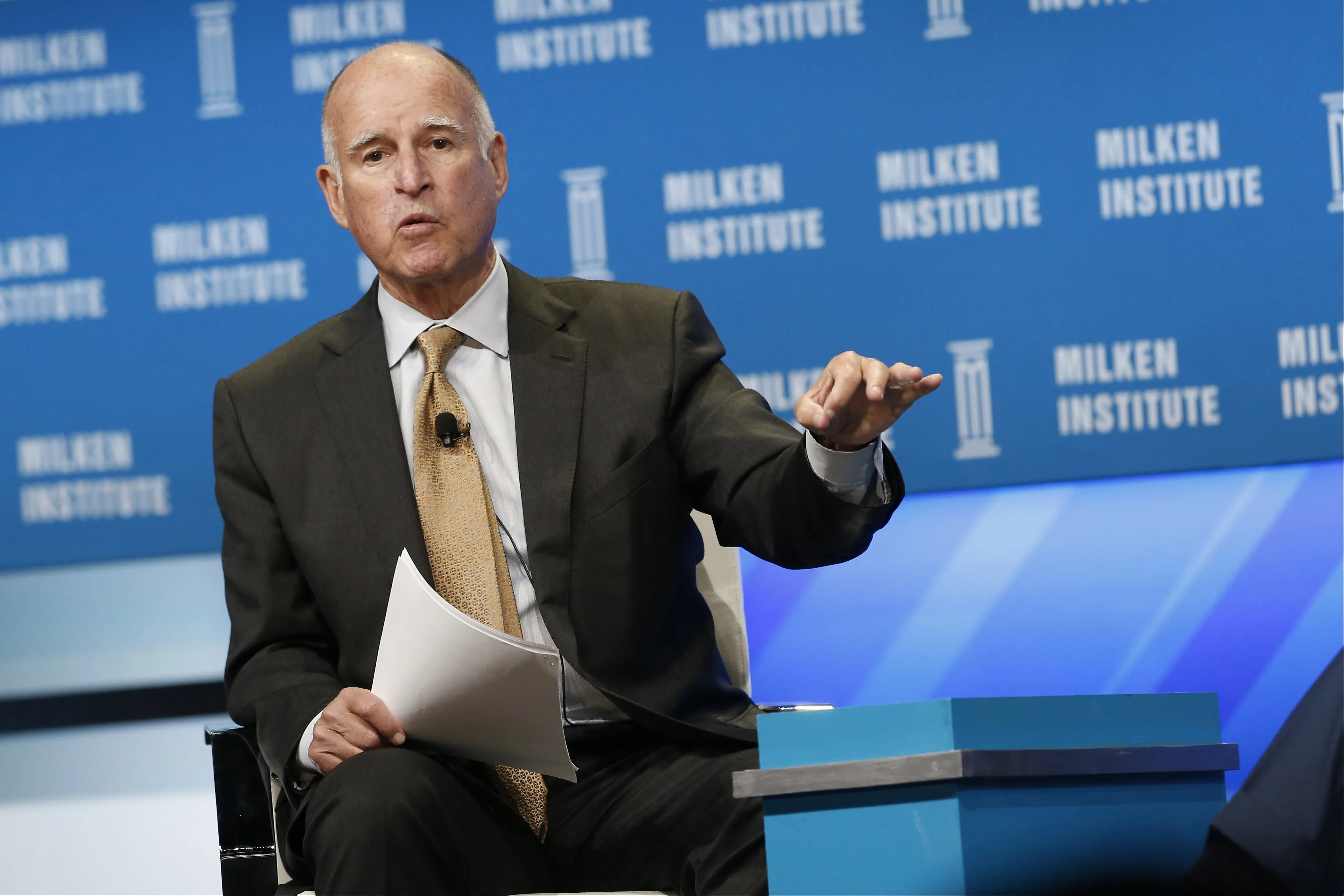 Jerry Brown, governor of California, speaks during the annual Milken Institute Global Conference in Beverly Hills, California, U.S., on Wednesday, April 29, 2015. The conference brings together hundreds of chief executive officers, senior government officials and leading figures in the global capital markets for discussions on social, political and economic challenges. Photographer: Patrick T. Fallon/Bloomberg *** Local Caption *** Jerry Brown
