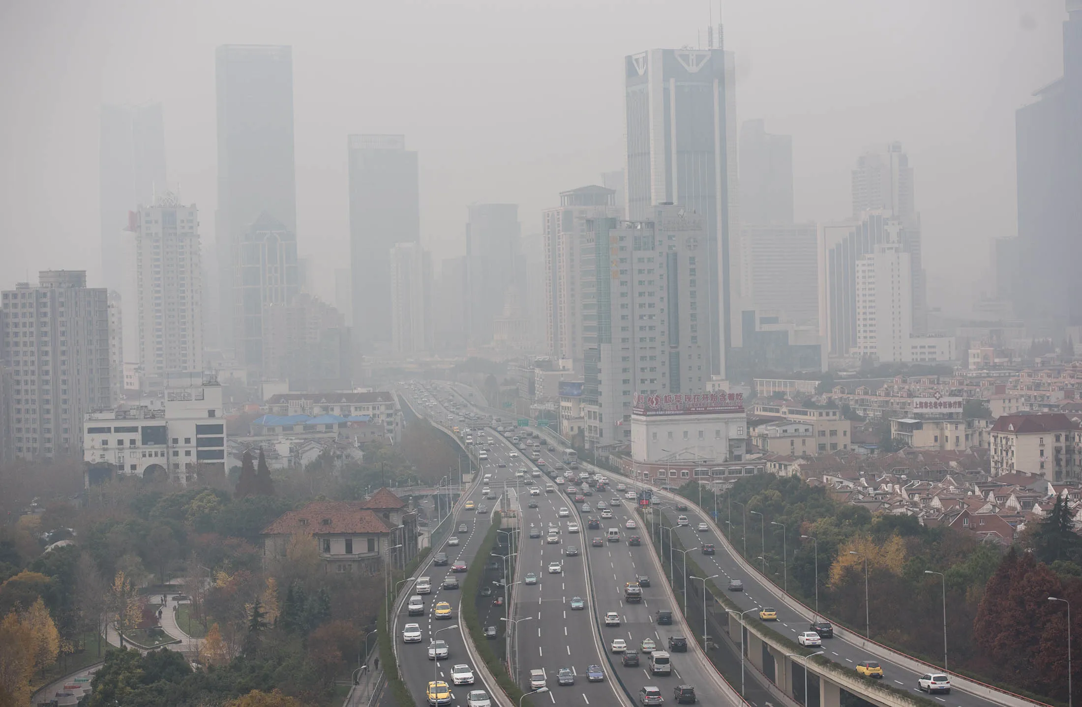 Heavy pollution hangs in the air over elevated motorways in Shanghai.
