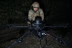 BAKHMUT DISTRICT, UKRAINE - NOVEMBER 12: A Ukrainian military man equips and prepares a drone for flight and prepares ammunition at positions 4 kilometers from the frontline as the special unit "Achilles" is preparing to carry out a combat mission at night on the heavy drone "Vampire", which the Russians call "Baba Yaga" on November 12, 2023 in the Bakhmut District, Ukraine. SkyFall, a Ukrainian company, has launched mass production of unmanned aerial vehicles. The new "Vampire" model can carry up to 15 kg of ammunition. The Armed Forces of Ukraine use Vampire hexacopters to drop different types of munitions on the enemy, such as cumulative and thermobaric, and are most often used against tanks and other armored vehicles. Unmanned aerial vehicles are equipped with a thermal imager, which allows you to attack the enemy in the dark. Ukrainian forces continue to fight to retake Bakhmut, which was captured by Russian forces in May, following a yearlong war battle. Over the summer, Ukraine regained territory north and south of Bakhmut but Russia has held the city itself. (Photo by Kostya Liberov/Libkos via Getty Images) Photographer: Libkos/Getty Images Europe