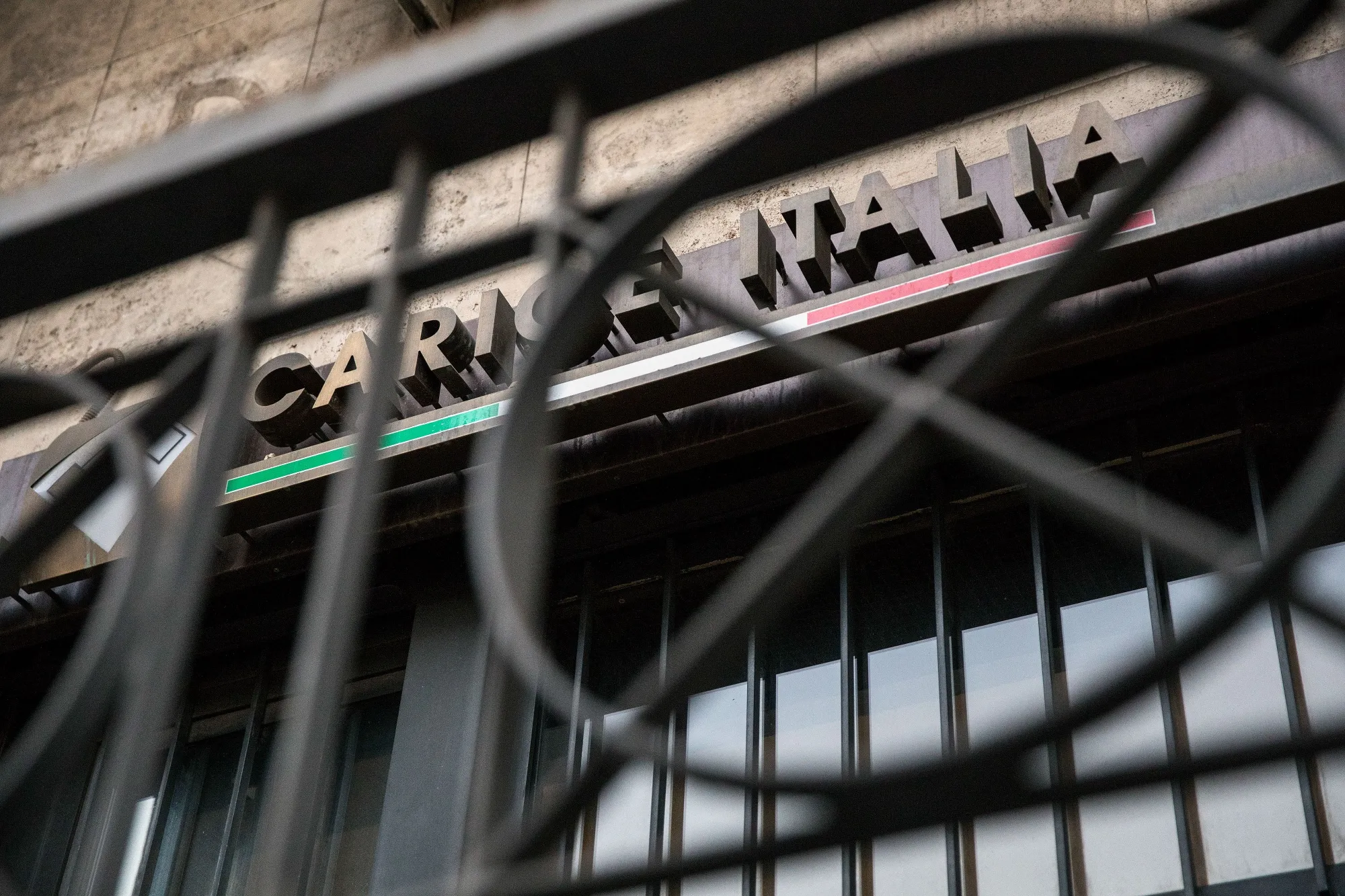 A Banca Carige SpA logo sits on a bank branch&nbsp;in Rome.