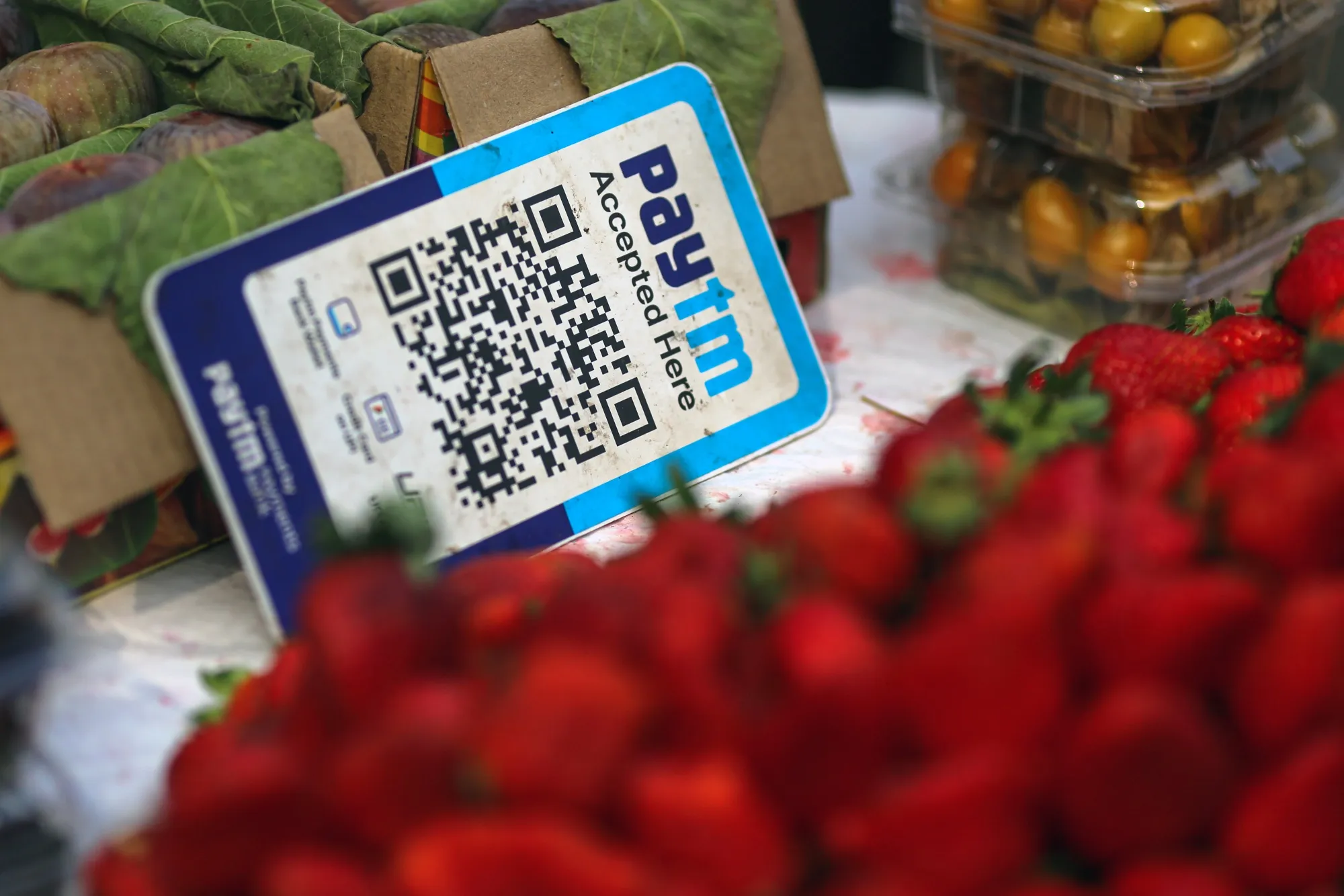 A QR code for the Paytm digital payment system at a roadside fruits stall in Mumba.