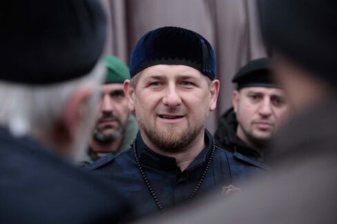 Chechen President Ramzan Kadyrov, center, speaks to Chechen top commanders while inspecting Chechen special forces in Grozny, Russia, on Dec. 28, 2014.
