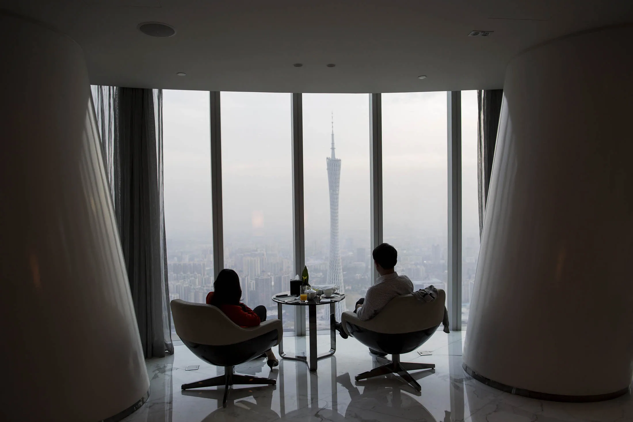People look out towards the Canton Tower in Guangzhou.
