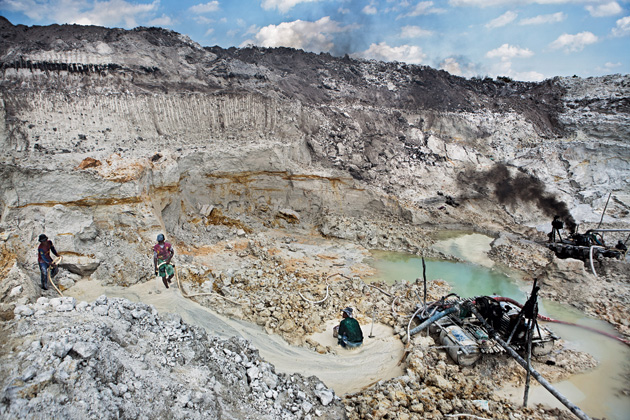 Miners in the pit where, in June, 18-year-old miner Johidi bin Gunadi was buried alive
