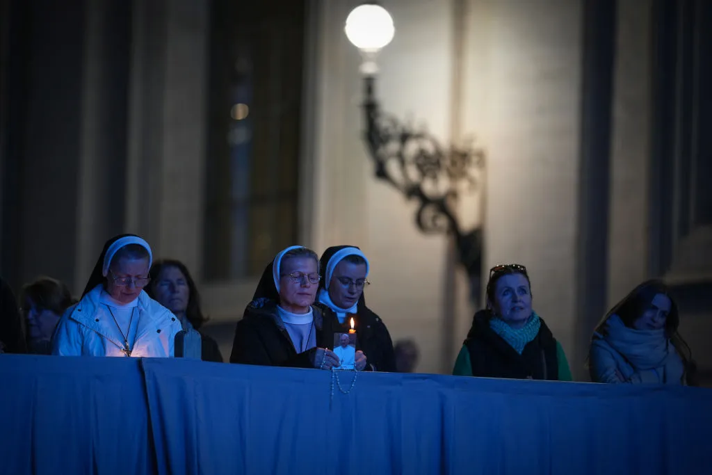 Nuns and the faithful pray in St Peter's Square for the health of Pope Francis.