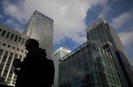 The Citigroup tower, right, in the Canary Wharf business, financial and shopping district of London.