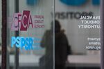 The Financial Conduct Authority logo on a door at their offices in London.