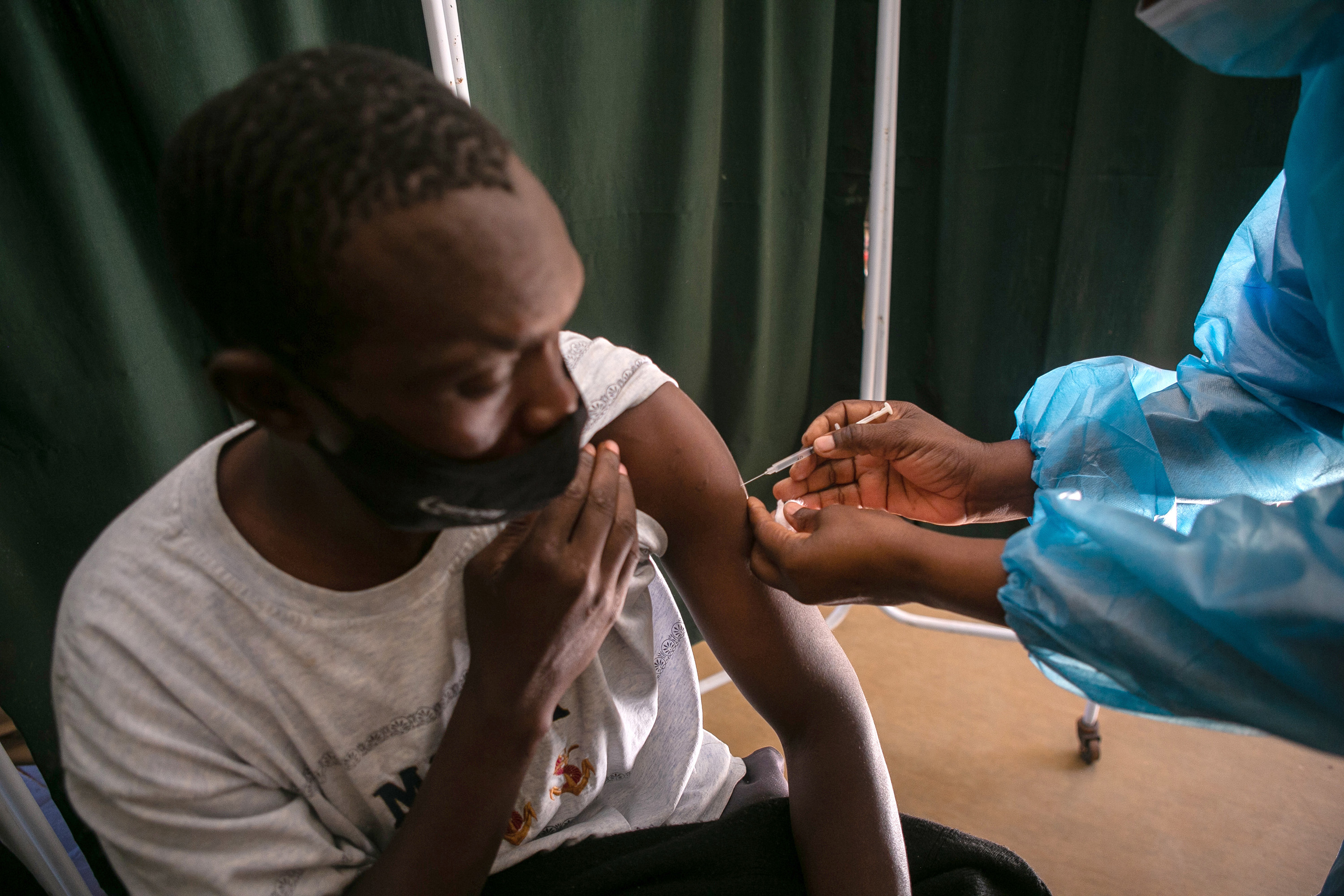 A man receives a vaccine at a hospital&nbsp;in Harare, Zimbabwe.&nbsp;