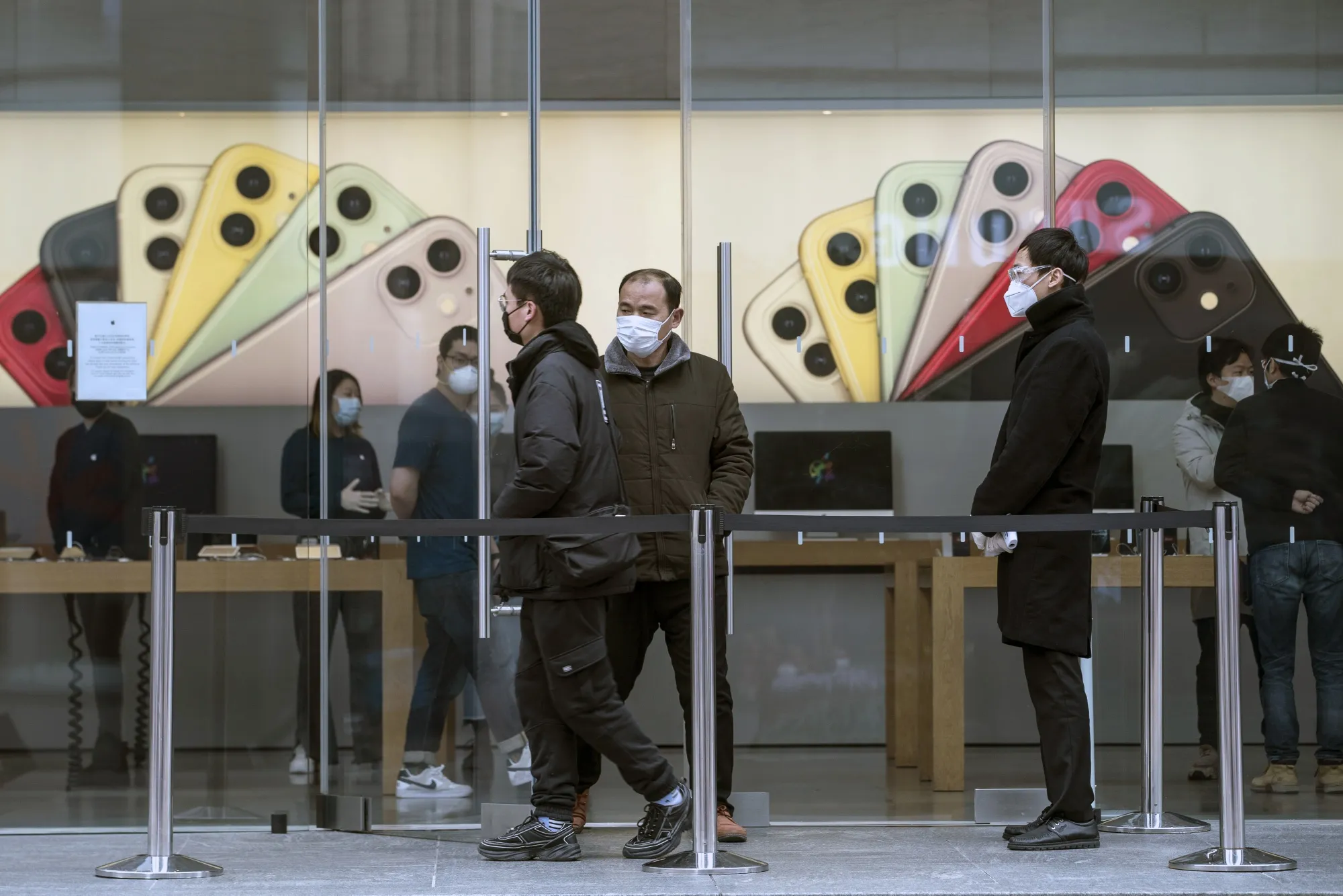 Customers browse inside an Apple store in Shanghai on March 2.