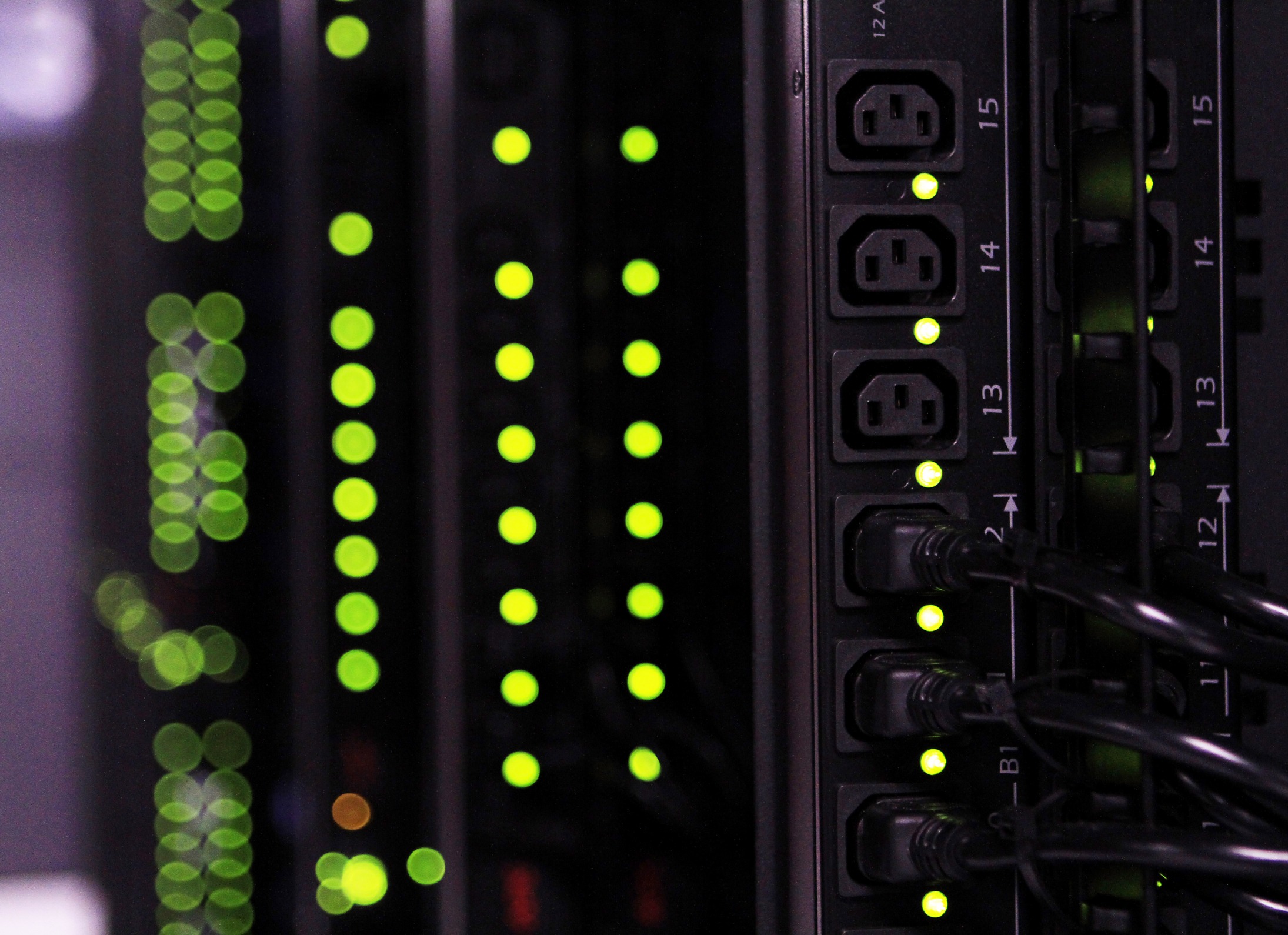Power outlets are seen on a row of cloud racks for servers and hard drives inside pod one of International Business Machines Corp.'s (IBM) Softlayer data center in Dallas, Texas, U.S., on Thursday, Jan. 16, 2014. IBM is scheduled to release earnings figures on Jan. 21.