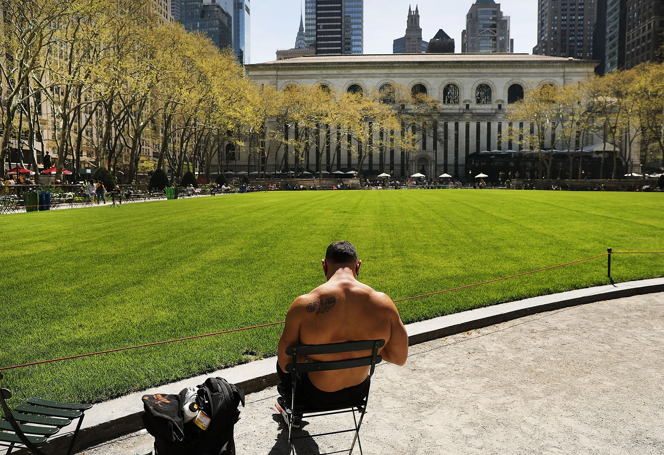 A man enjoys a warm spring day at Bryant Park in Manhattan on May 2, 2018.