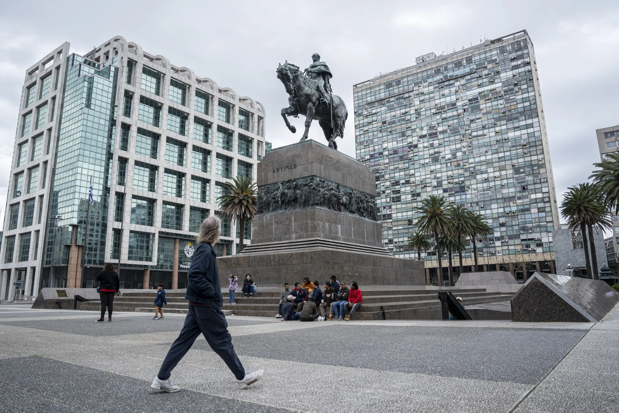 Pedestrians walk through Independence square in Montevideo, Uruguay.