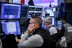 Traders work on the floor of the New York Stock Exchange.
