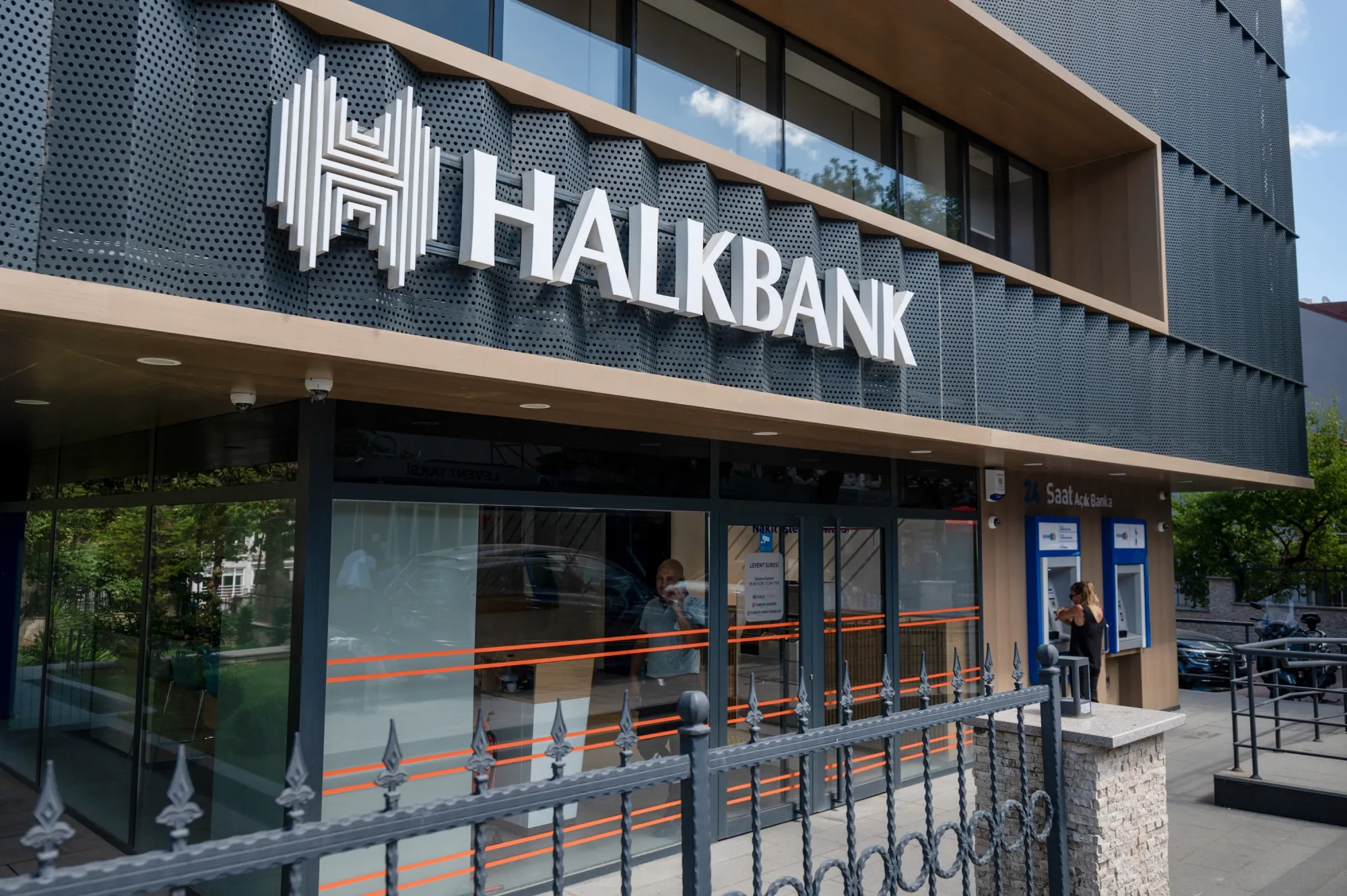 A sign on the exterior of a Turkiye Halk Bankasi AS bank branch in the Levent district in Istanbul.