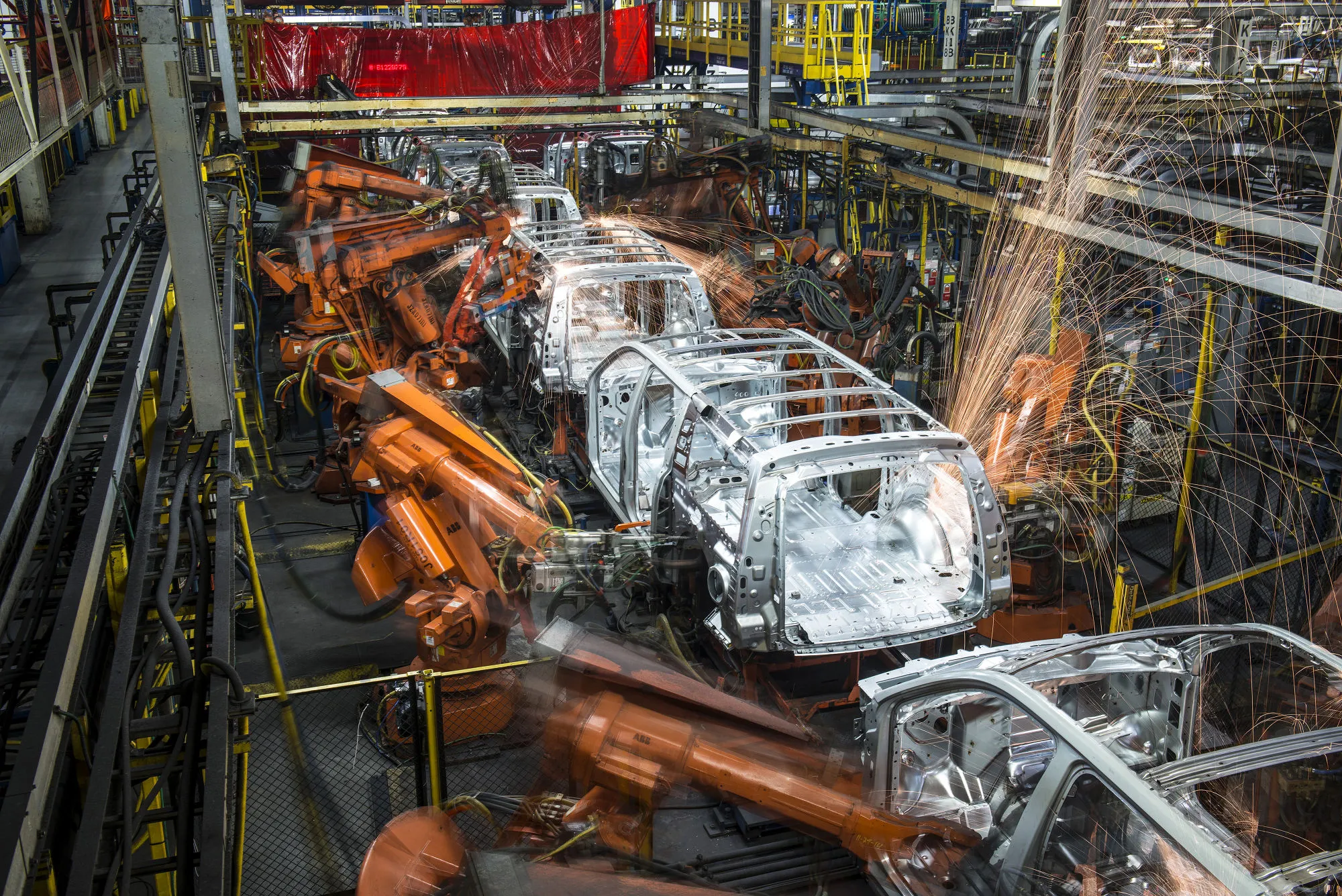 Robotic machines weld together the frames of&nbsp;vehicles during production at the General Motors Co.&nbsp;assembly plant in Arlington, Texas.