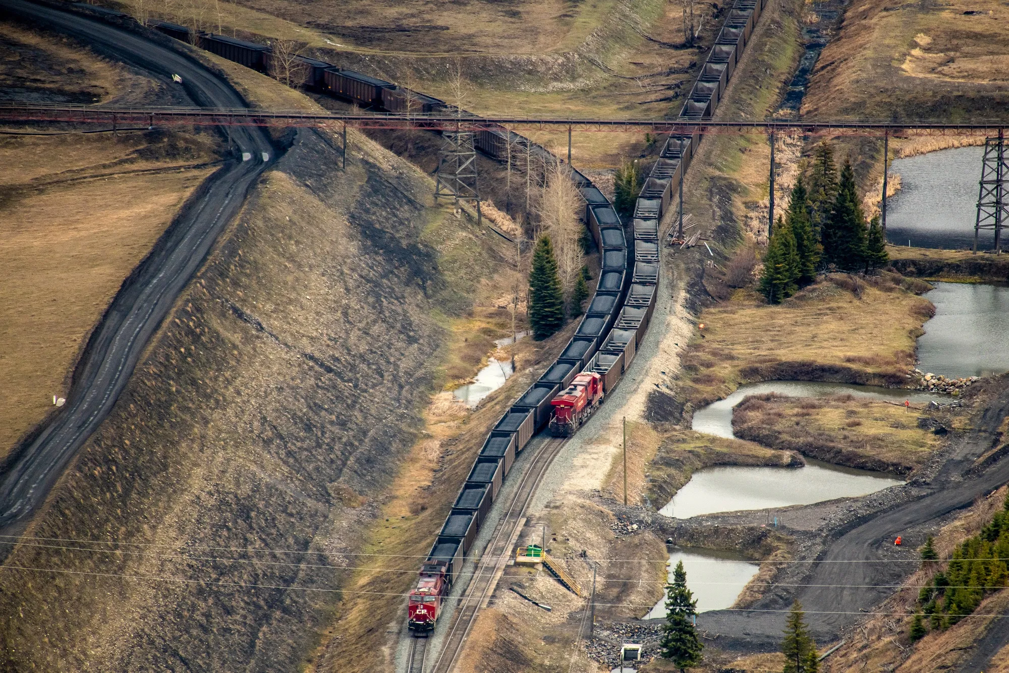Train cars are loaded with coal at a Teck Resources Elkview Operations steelmaking coal mine in the Elk Valley, British Columbia, Canada.