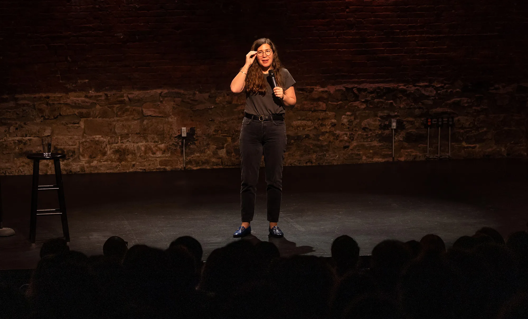 Alison Leiby stands on stage during her show “Oh God, A Show About Abortion”&nbsp;at Cherry Lane Theater in New York.