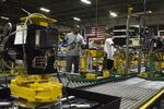 Employees assemble industrial fans at a manufacturing facility in Lexington, Kentucky.