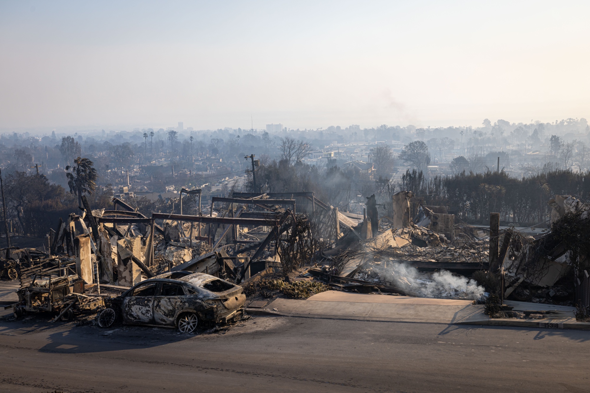 Remnants of homes and businesses reduced to ashes in the aftermath of the Palisades Fire in the Pacific Palisades neighborhood of Los Angeles, on Jan. 9.
