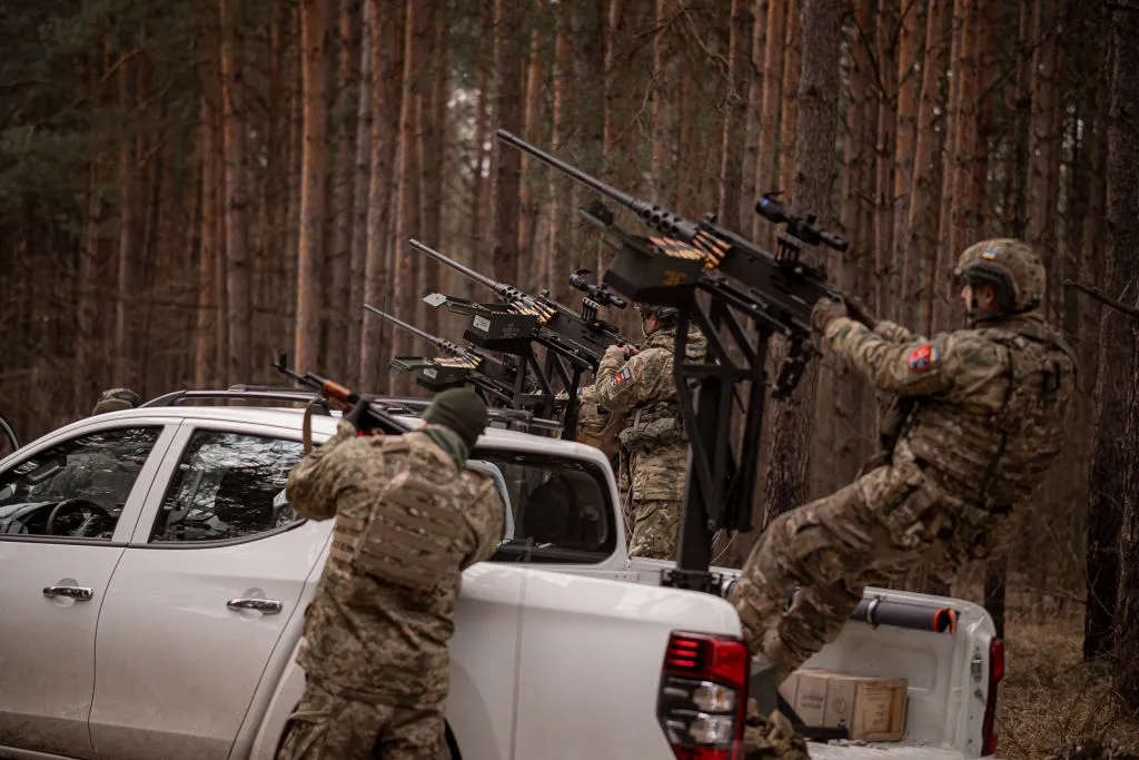 Ukrainian soldiers attempt to&nbsp;shoot down Russian drones in Kyiv Oblast on March 31.