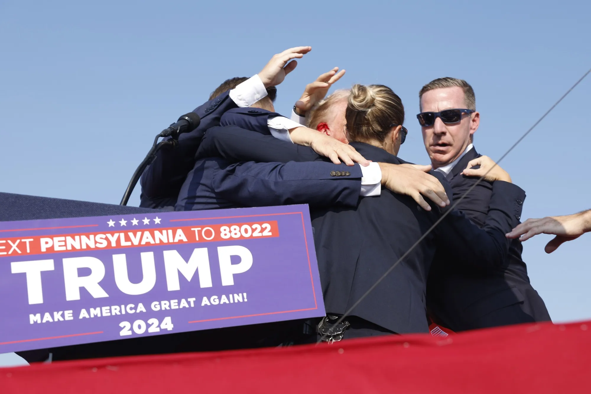 Republican presidential candidate former President Donald Trump is rushed offstage during a rally in Butler, Pennsylvania, on July 13.