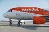 Ground crew inspect the underside of an EasyJet passenger aircraft at Nice Cote d'Azur Airport, France.