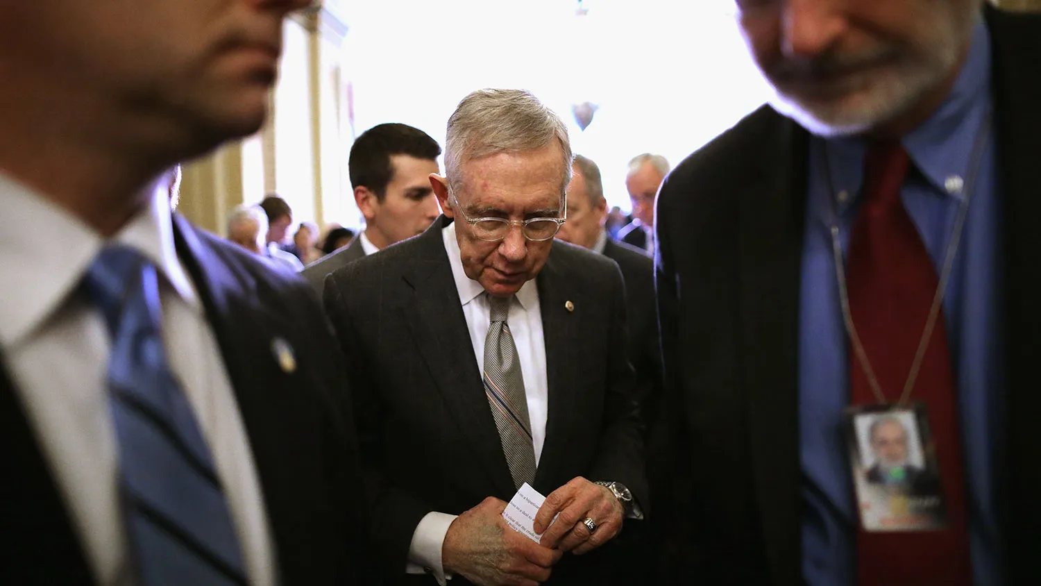 Senate Minority Leader Harry Reid returns to the Senate chamber after talking to reporters at the U.S. Capitol on Dec. 15, 2015.
