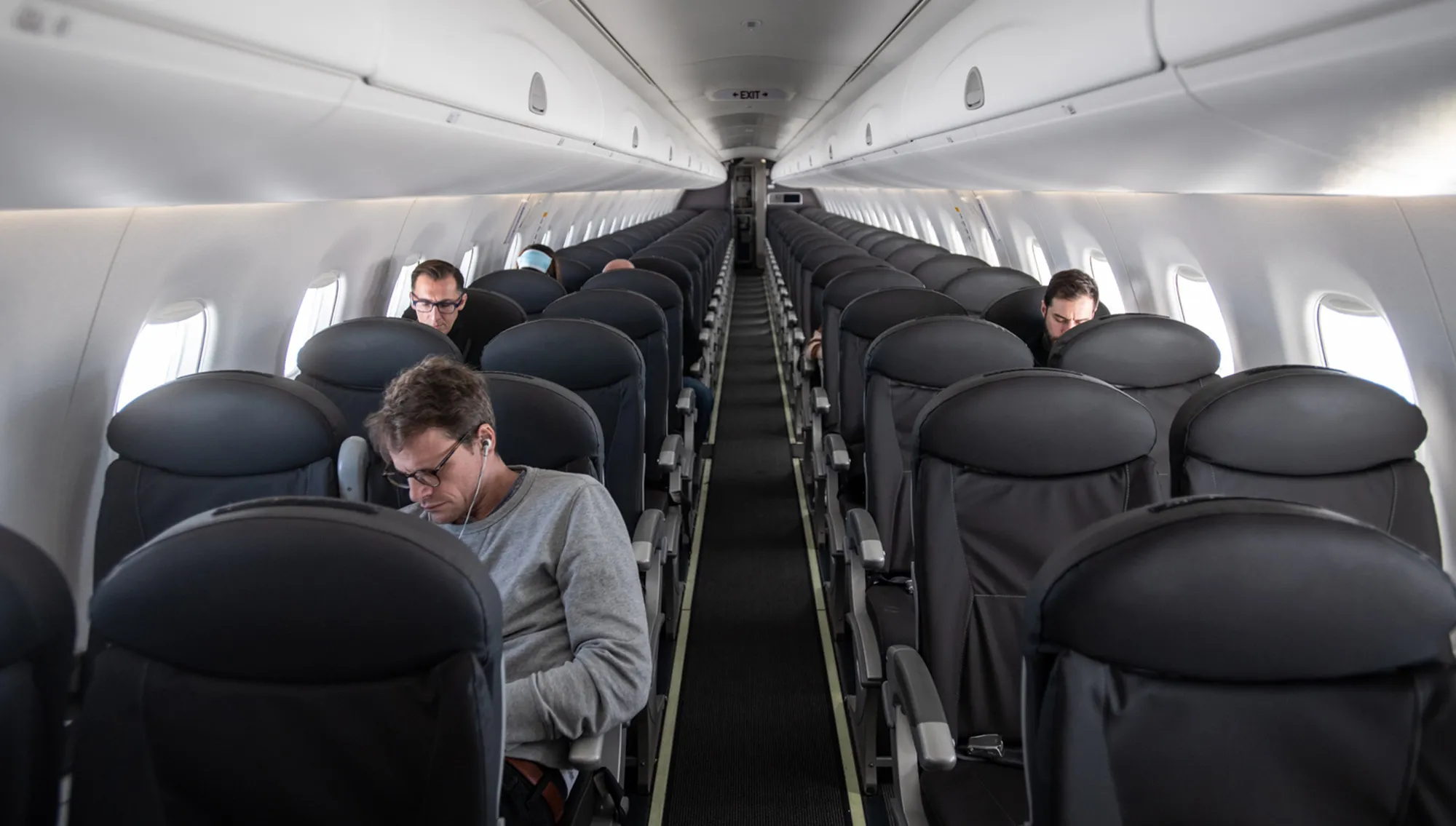 An almost empty plane flies from Milan to London.