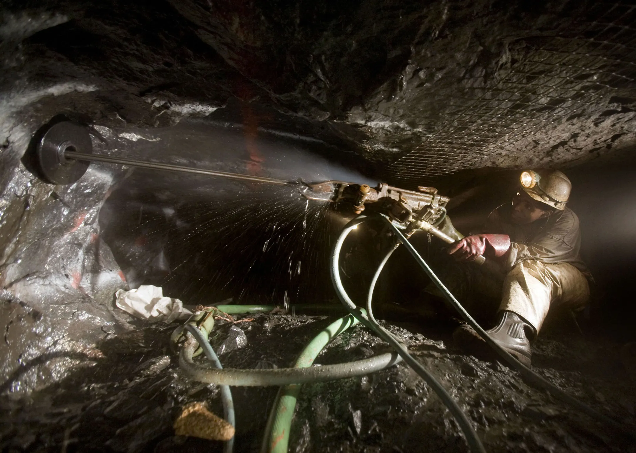A mine worker uses a drill on the rock face&nbsp;at the Impala Platinum mine in Rustenburg, South Africa.
