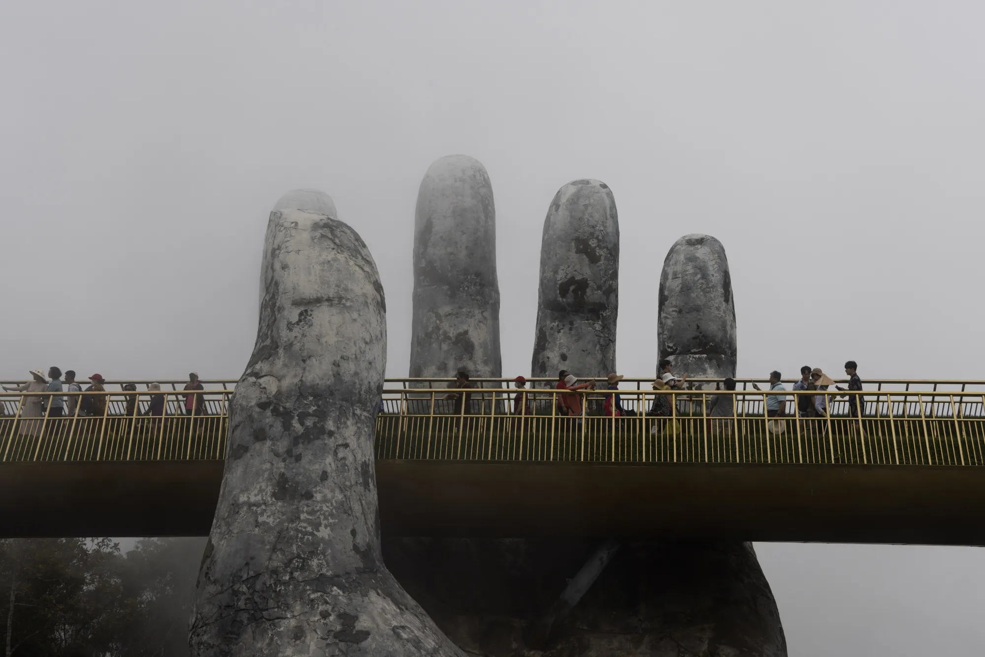 Tourists on the golden bridge in Da Nang, Vietnam.