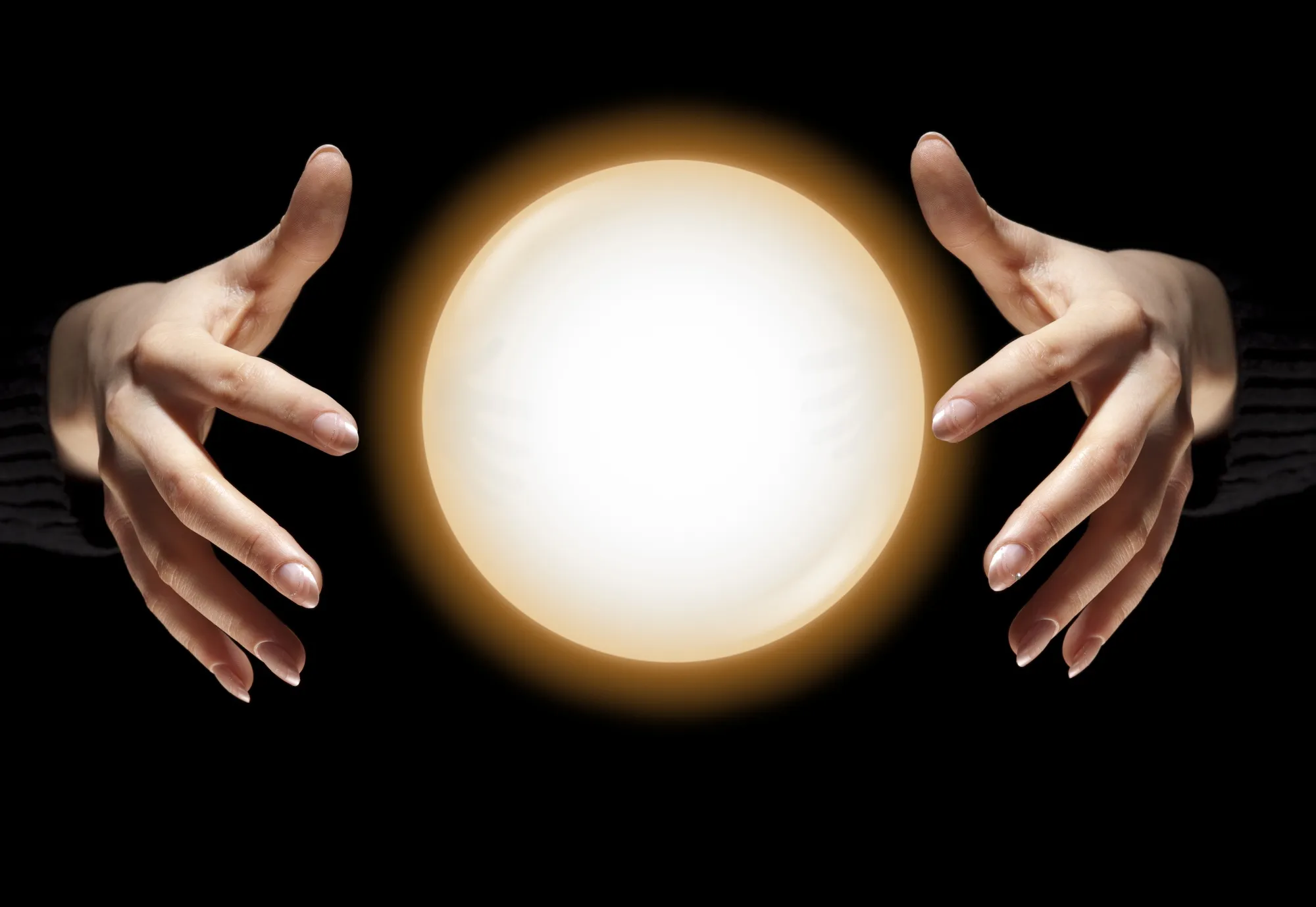 Fortune Teller's Hands With Glowing Crystal Ball, Dark Black Background