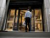 A person enters the Deutsche Bank AG headquarters at 60 Wall Street in New York, U.S.