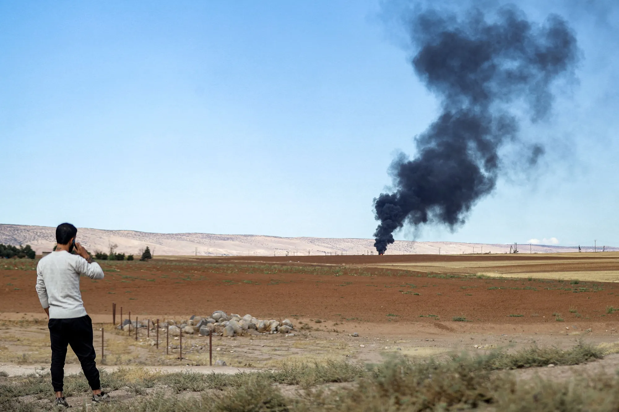 Fire rages at the Zarba oil facility in al-Qahtaniyah in northeastern Syria close to the Turkish border on Oct. 5.