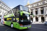 A FlixBus&nbsp;coach drives past the Palais Garnier opera house in Paris on May 19, 2015.