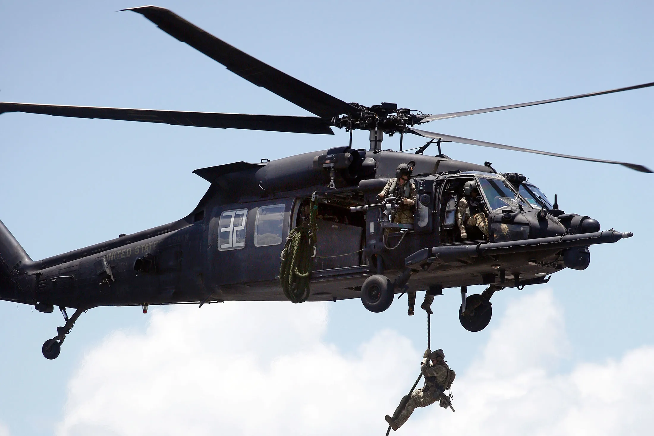 A U.S. Army 160th Special Operations Aviation Regiment (SOAR) soldier climbs a rope from a UH-60 Blackhawk helicopter during an International Special Operations Forces capacities exercise in Tampa, Florida, on May 23, 2018.&nbsp;