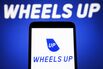 In this photo illustration, Wheels Up logo is seen on a
