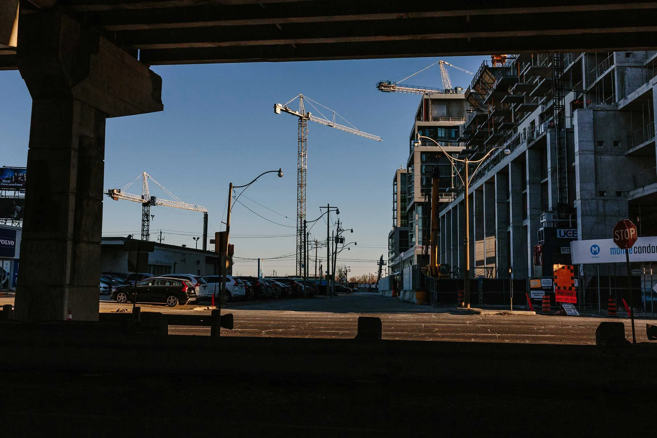 Condominium buildings stand under construction along Lakeshore Boulevard in Toronto.
