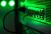 Green light illuminates the case of a mining rig operating inside a shipping container converted into a mobile cryptocurrency mining farm, operated by BitCluster, at Rodniki Industrial Park in Rodniki, Russia, on Tuesday, Feb. 6, 2018.
