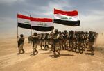 Iraqi soldiers take part in a training exercise at Basmaya camp in Baghdad, on May 27, 2015.
